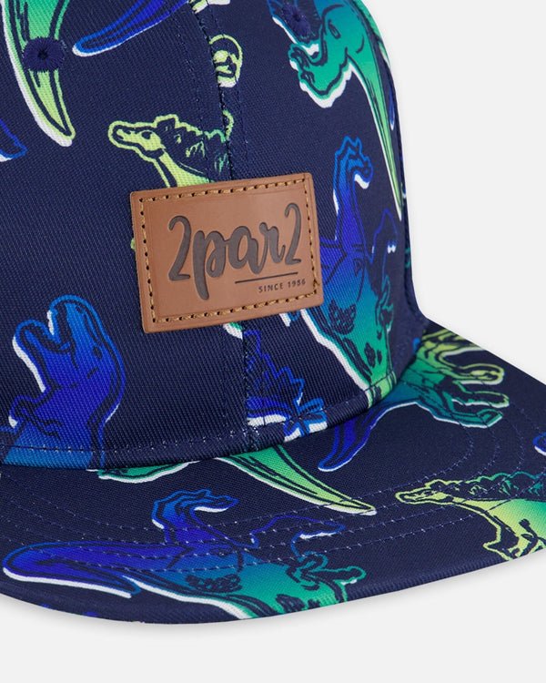 Deux par Deux - Printed Cap Blue And Green Dino On Navy - Two Giraffes Children's Footwear